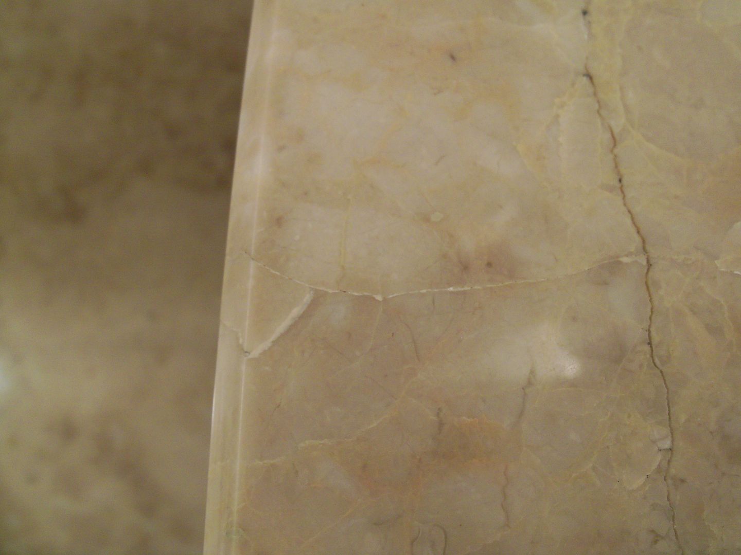 Can a cracked marble vanity top be repaired?